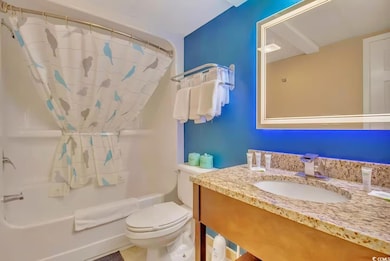 Full bathroom featuring shower / bath combo with s