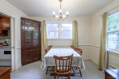 Dining room with built-in hutch, chair rail, and p