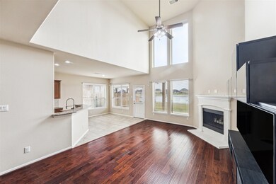 This spacious living area features high ceilings,
