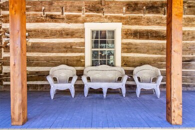 Inviting front porch with beams made from cedar mi