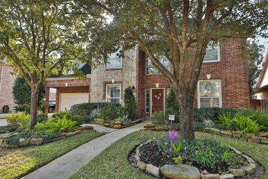 This gorgeous surrounded by mature trees and a beautifully manicured landscaping on all sides.