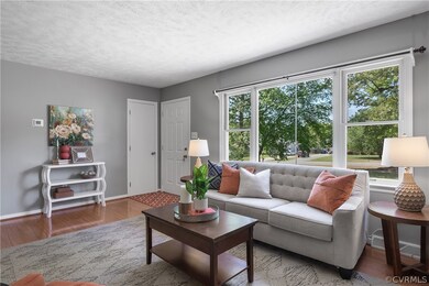Living room with a healthy amount of sunlight, a t