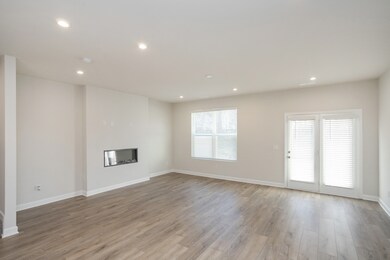 Another view of the family room w/fireplace