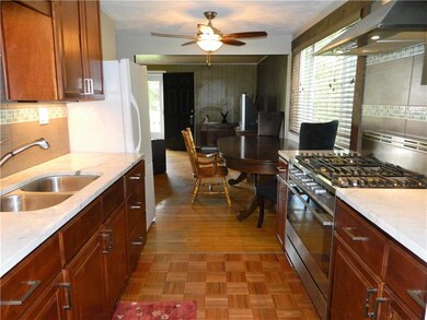 The dining area is located between the living room