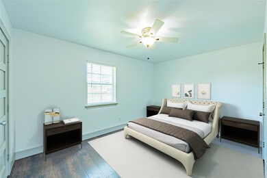 Bedroom with ceiling fan and dark hardwood / wood-