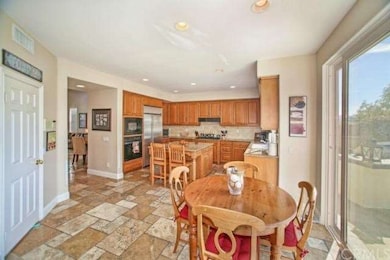 Kitchen opens to nook and family room, great areas