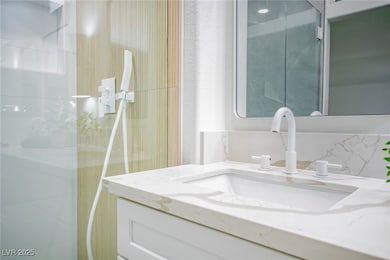 Bathroom with vanity and a walk in shower