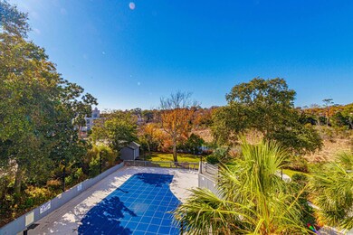 View of pool with a shed