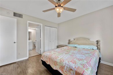 Bedroom featuring a closet, wood finished floors, 