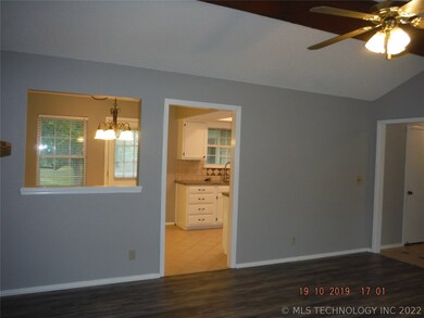 View from living room to dining area and kitchen.