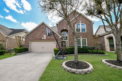  The exterior is accented with large windows and m