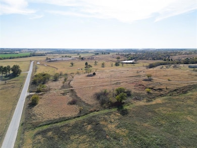Aerial view of property and surrounding area with rural landscape