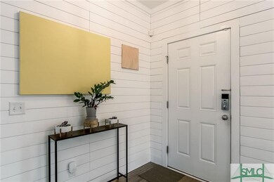 Custom shiplap walls in foyer.