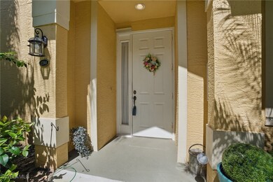 View of exterior entry with stucco siding