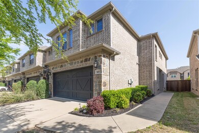 View of front facade featuring an attached garage,