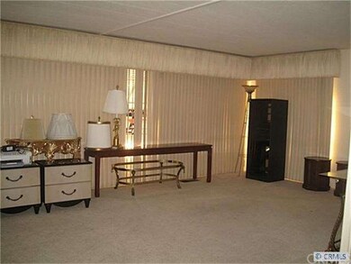 Spacious neutral living area with lots of windows.