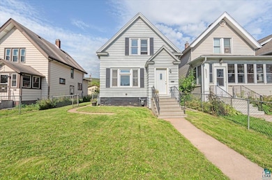 View of front of property with a front yard
