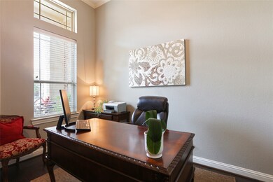 Conveniently located off of the inviting entry is the home office.  Perfect vantage point to see the front of the home and be aware of all your home deliveries.