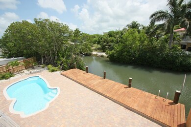 Looking down at pool, canal from porch