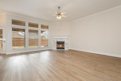 Unfurnished living room with a high end fireplace,