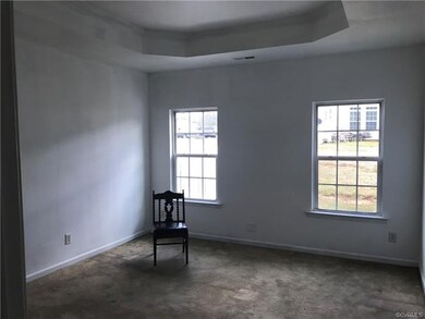 First floor master bedroom is located off of cente