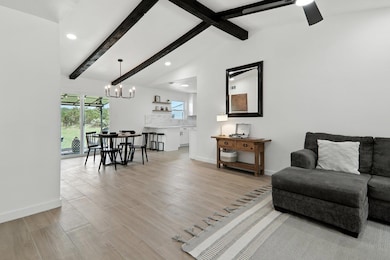 Living room with light wood-style floors, recesse
