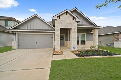 View of front of house with concrete driveway, boa
