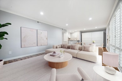 Inside the unit, the spacious living room boasts w