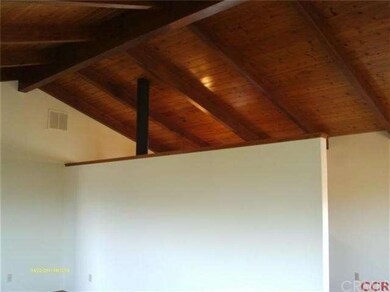 Custom ceiling extending from living room into kit