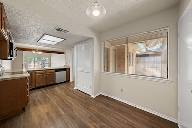 Kitchen featuring stainless steel appliances, dar