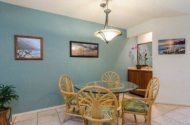The dining room has tiled floors and a wet bar.