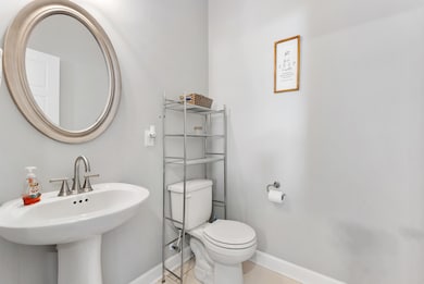 Downstairs half bath with a pedestal sink.  561 Tacoma Dr Clarksville TN 37043