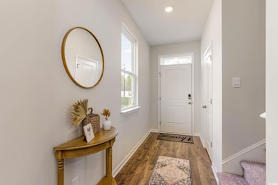 Doorway to outside with stairs, wood finished floo