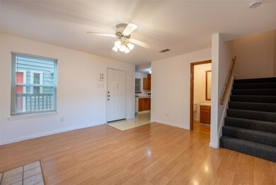 Unfurnished living room featuring stairs, ceiling
