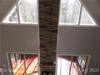 22' high stone accent wall has ledges for art disp