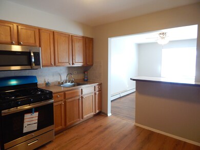 EAT IN KITCHEN WITH NEW FLOORING AND NEW OVEN & MI