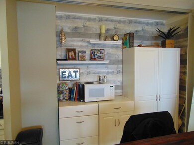 The closet on the back wall of the dining room has