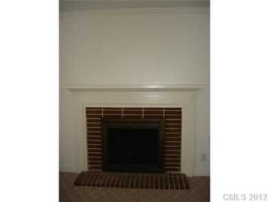 Living Room - Living Room that includes a fireplace with glass enclosure.