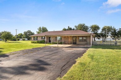 Ranch-style house featuring a front lawn