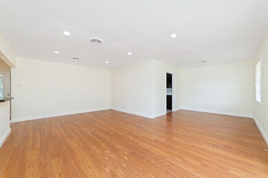 This spacious living room features beautiful lamin