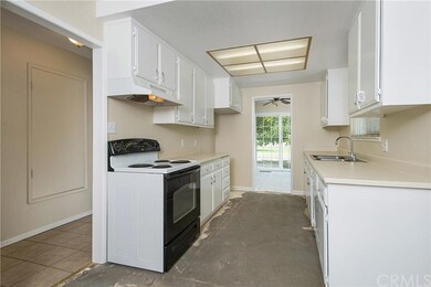Farmhouse style kitchen with charming white cabine