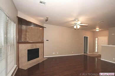 Gorgeous laminate wood flooring and a huge tiled f