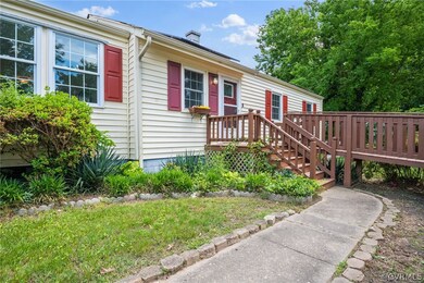 View of front of home with a wooden deck
