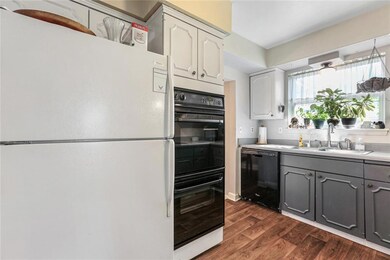 Kitchen showing double oven, fridge and dishwasher