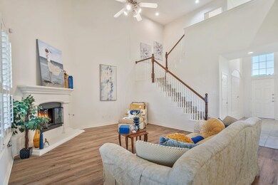 Living room featuring a high ceiling, wood finishe