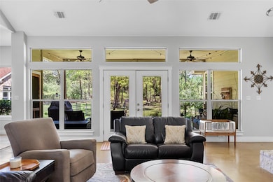 Sunroom / solarium featuring french doors and vis