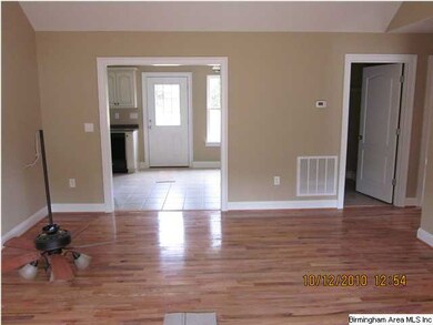 View 2 of living room. Kitchen door to the left. L