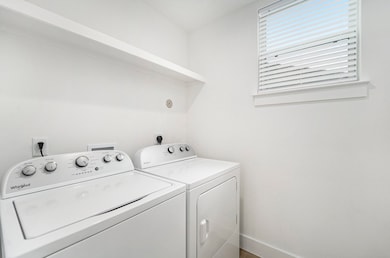 Utility room with new washer and dryer