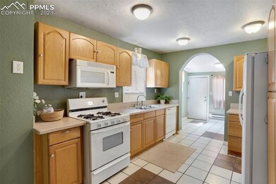 Kitchen with solid surface counter tops.