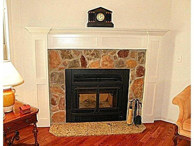 Living Room. A handsome, Air-tight Energy efficient  gas  fireplace. The rocks match the homes exterior rock trim